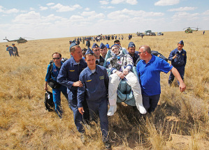 Dzhezkazgan, Kazakhstan: A rescue team carry US astronaut Donald Pettit